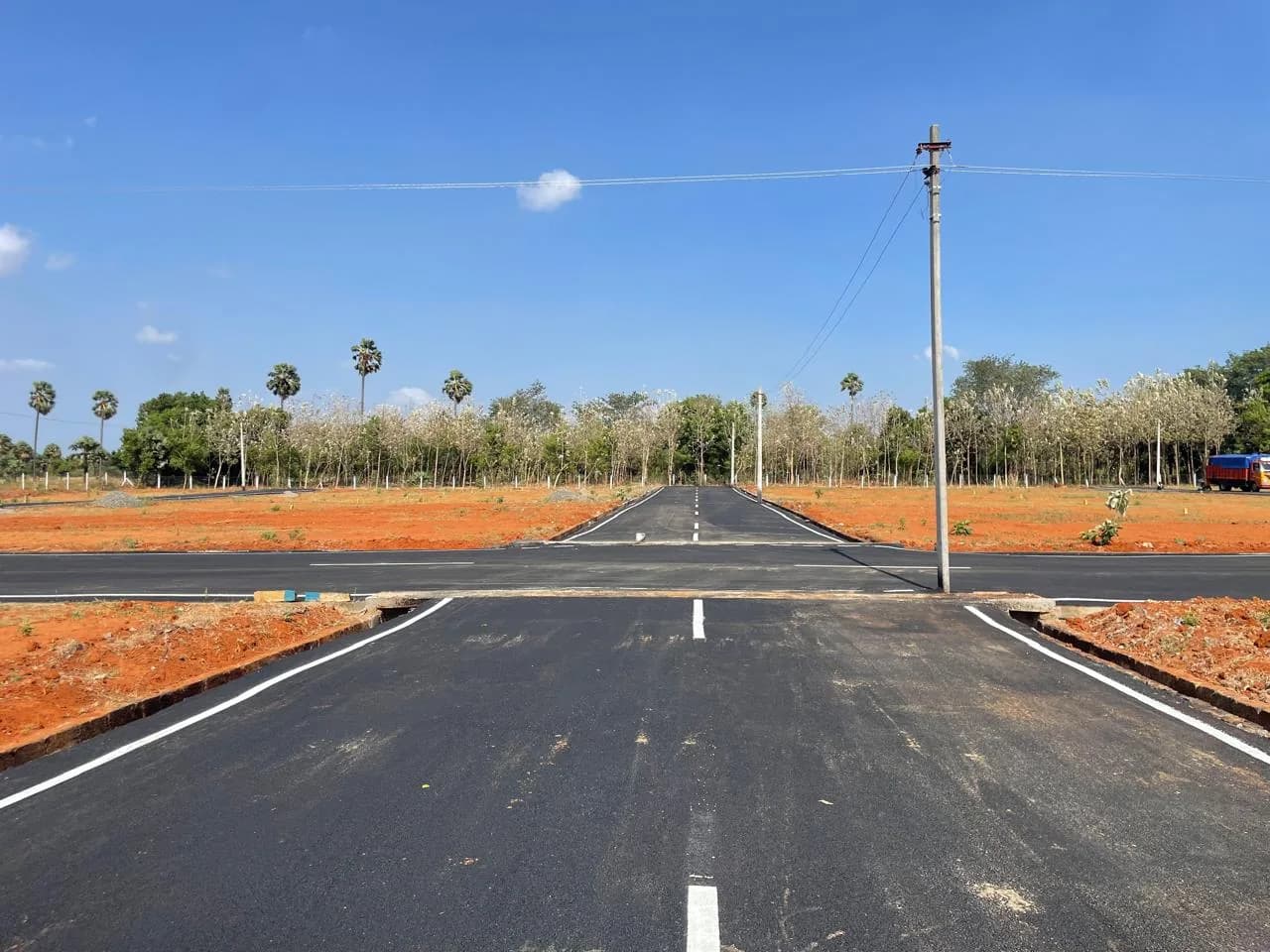Black-top internal road at the Vijaya Gardens plot layout in Tenkasi